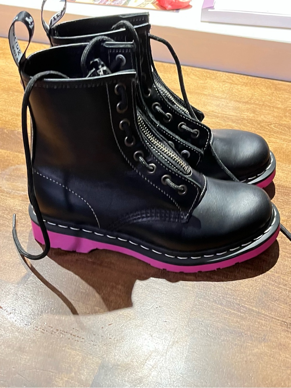Dr. Martens Black Leather Lace-Up Boots with Pink Platform Sole